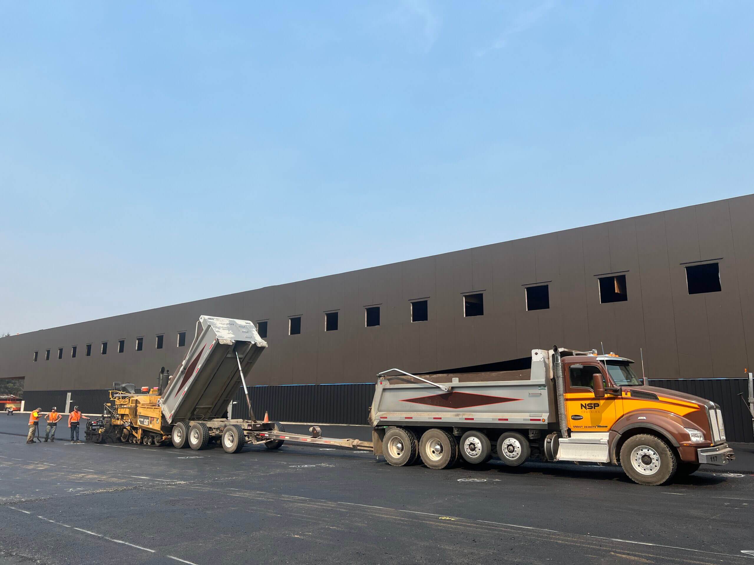 Asphalt paving a truck yard at a manufacturing & distribution center in Wilsonville, OR by North Santiam Paving